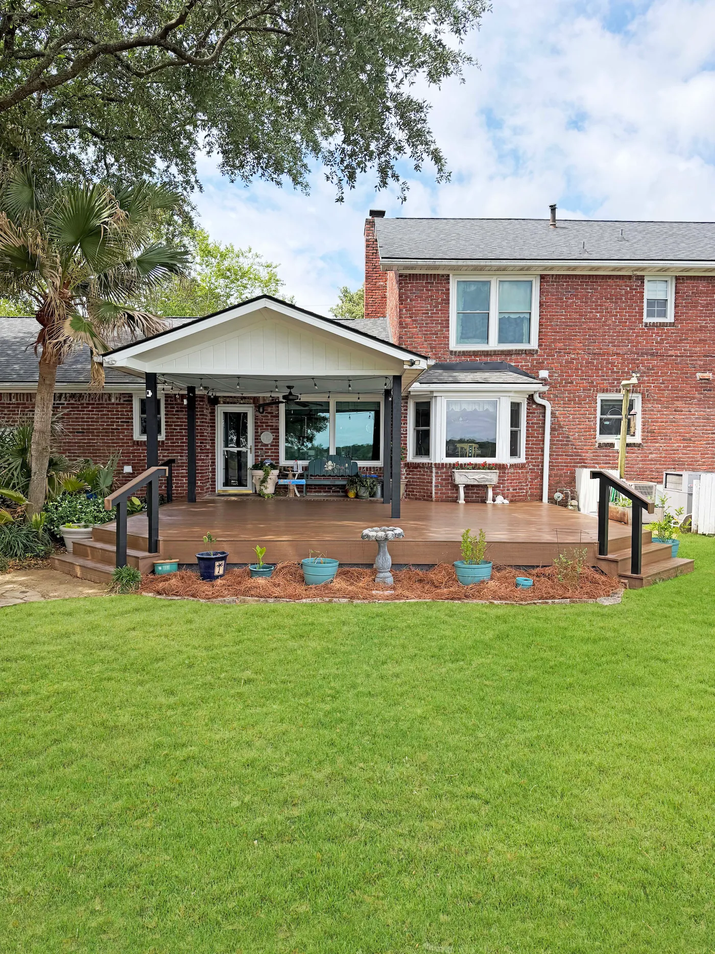 Covered porch addition with yard